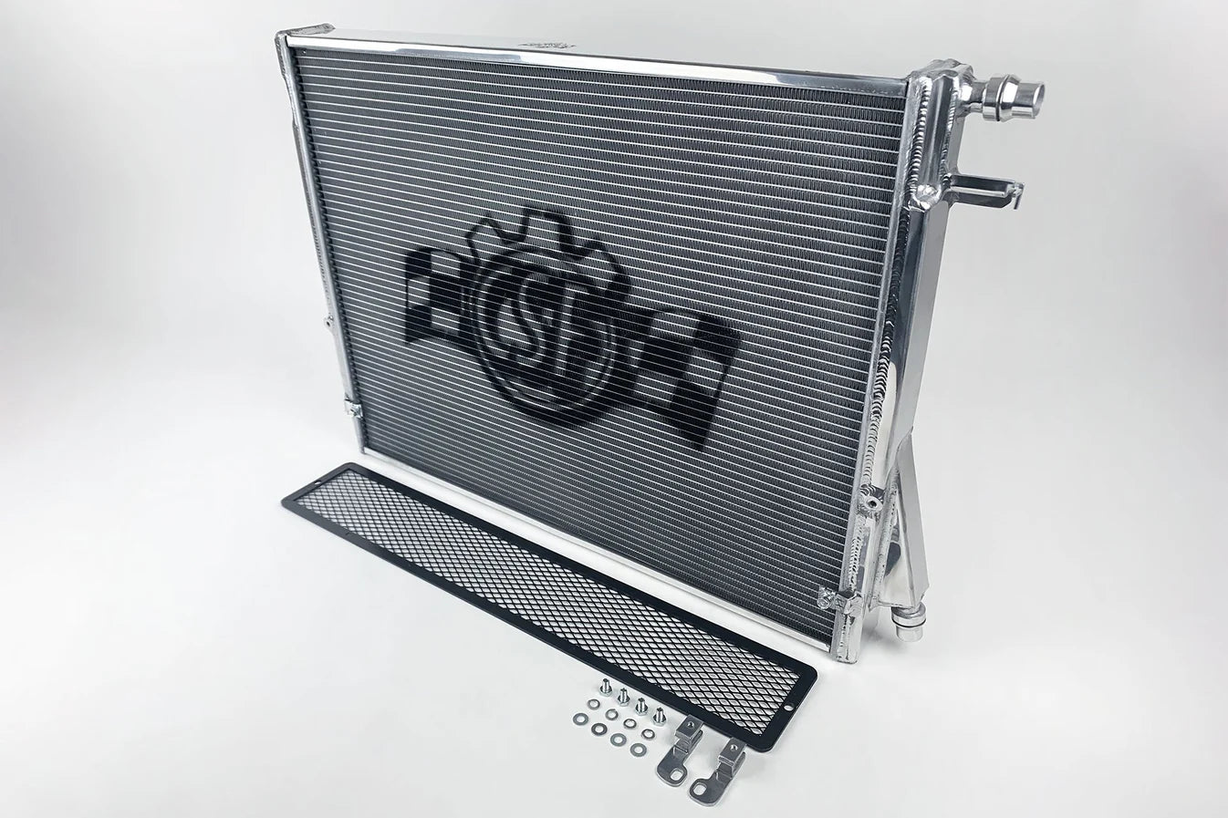 Heat exchanger radiator with rock guard, inlet/outlet ports, and included hardware kit