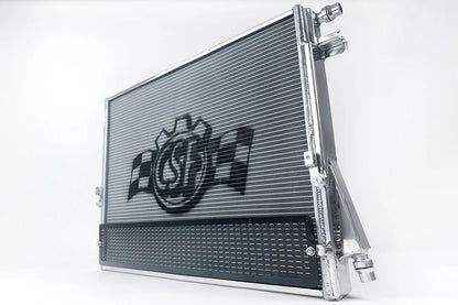 Performance heat exchanger radiator with protective rock guard panel and barb connectors
