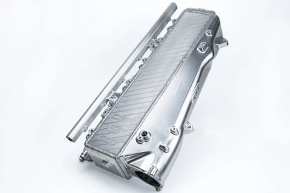 Charge-air cooler manifold, silver aluminum with finned heat exchanger and mounting ports
