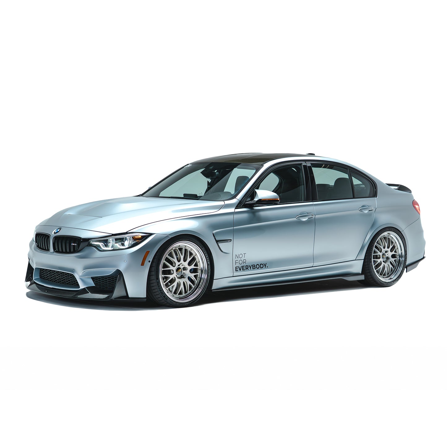 BMW front bumper lip spoiler in dark carbon fiber, front-left side view