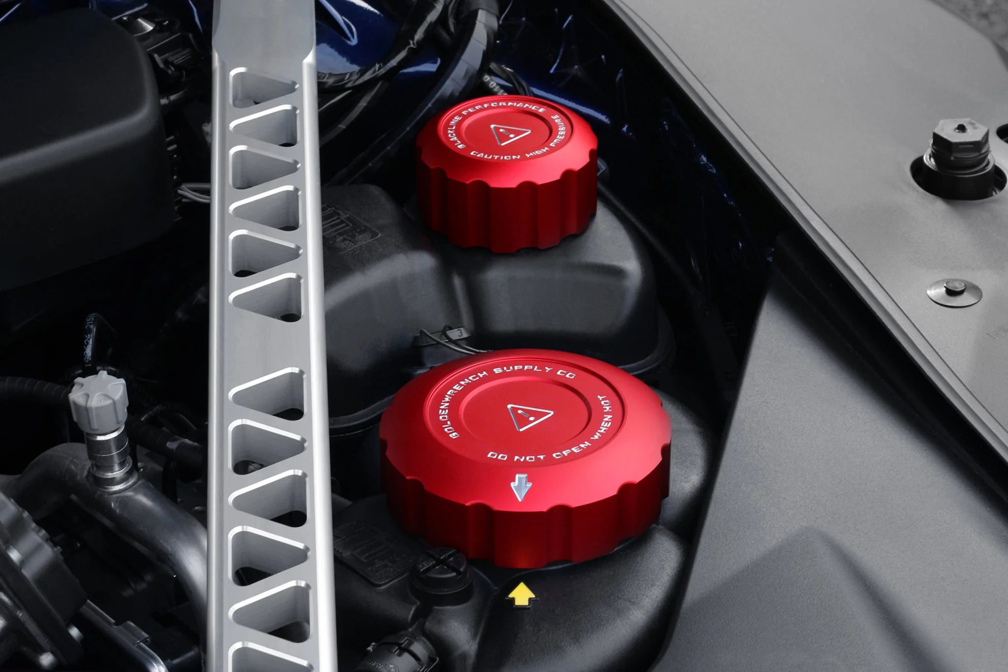 Coolant cap cover set: red cap covers installed on engine coolant reservoirs