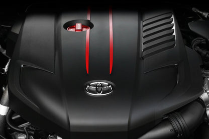 Red oil cap cover with BLACKLINE text on black engine cover