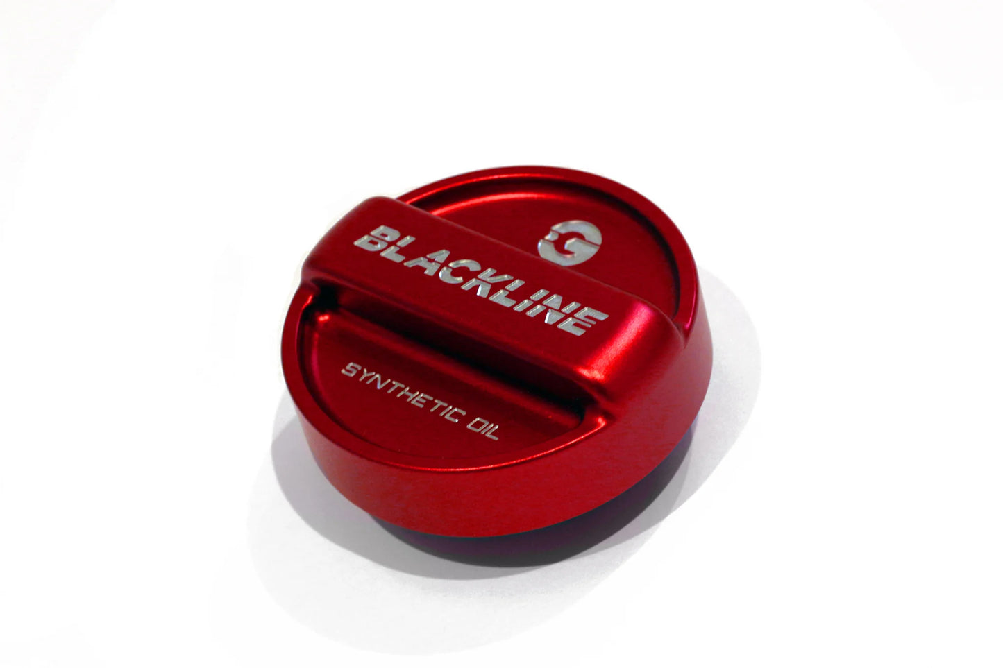 Red circular oil cap cover with BLACKLINE and synthetic oil text