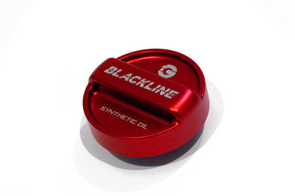 Red circular oil cap cover with BLACKLINE and synthetic oil text