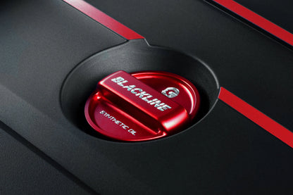 Red performance oil cap cover with BLACKLINE lettering, shown in engine bay