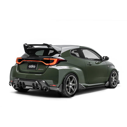 ADRO carbon fiber rear diffuser for Toyota GR Yaris, installed view, matte green car with black wheels and large wing.