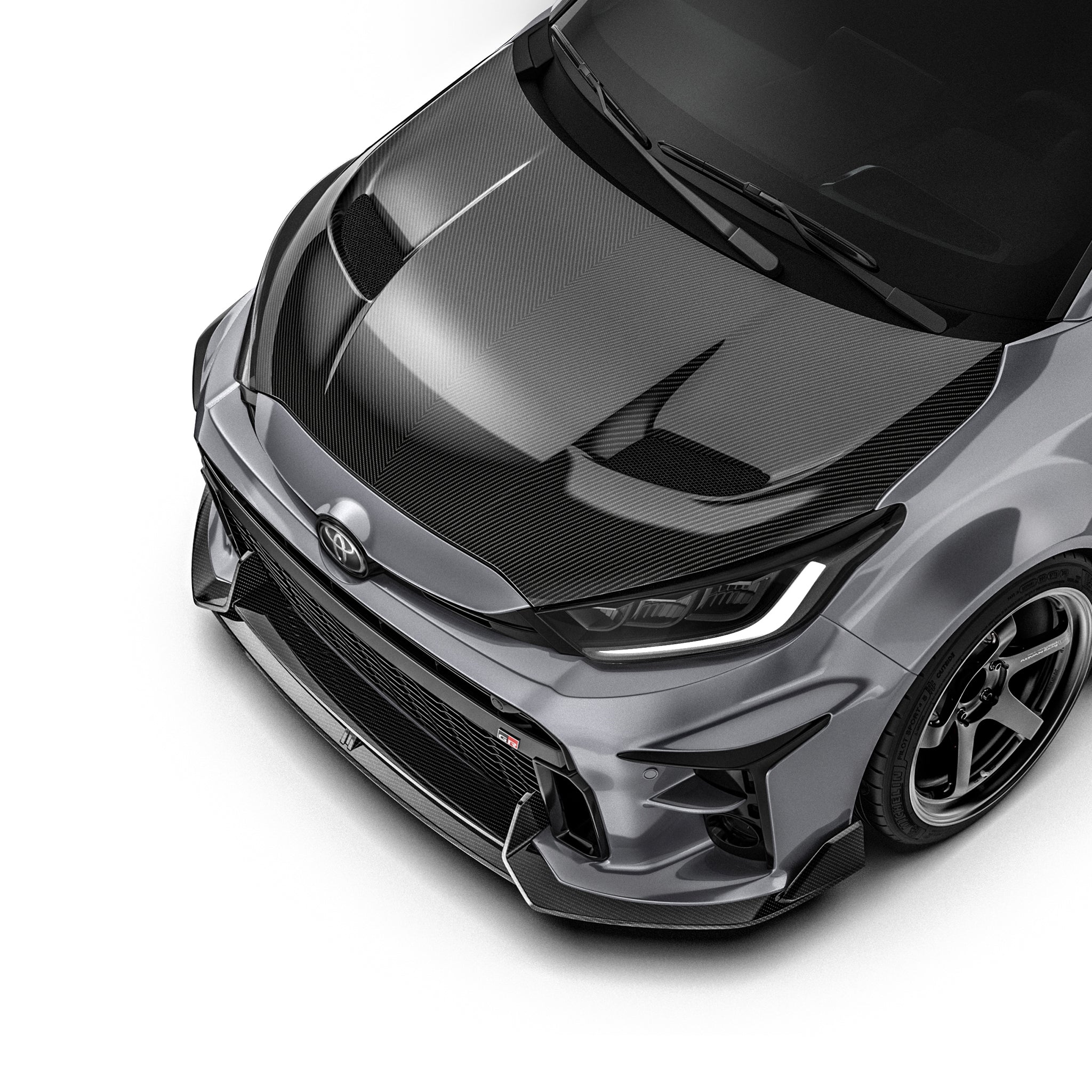 Prepreg hood, black carbon-fiber weave with sculpted aerodynamic contours