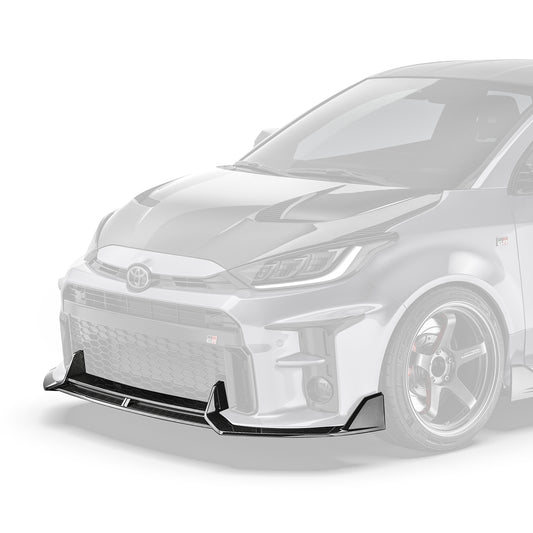 Carbon fiber front lip with dark woven texture, mounted at the lower front bumper edge.