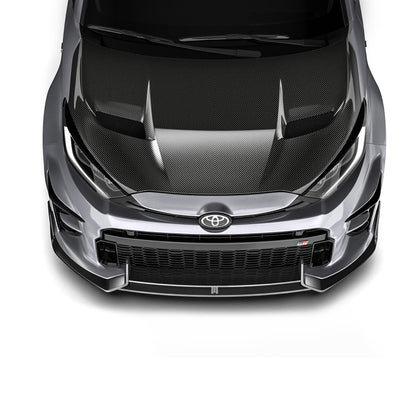 Carbon fiber front lip panel with dark texture, seen from a centered front view.