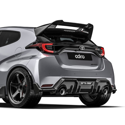 Carbon fiber rear diffuser panel with black weave finish and twin exhaust outlets