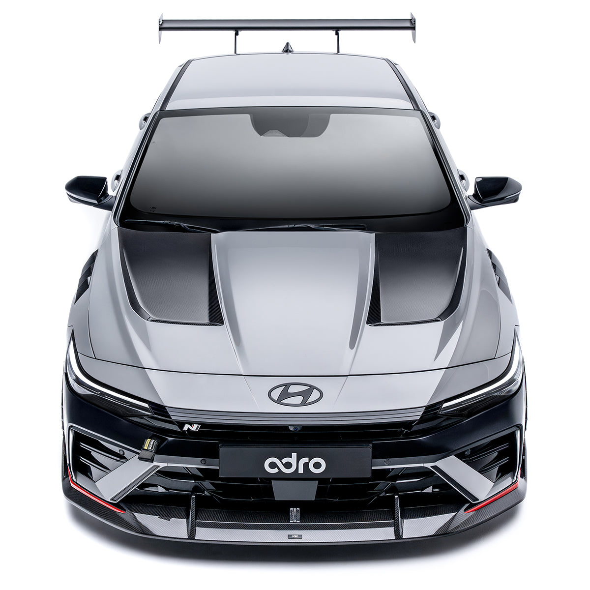 Sports car front lower diffuser with black center section and carbon-fiber style trim