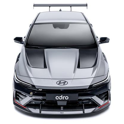 Sports car front lower diffuser with black center section and carbon-fiber style trim