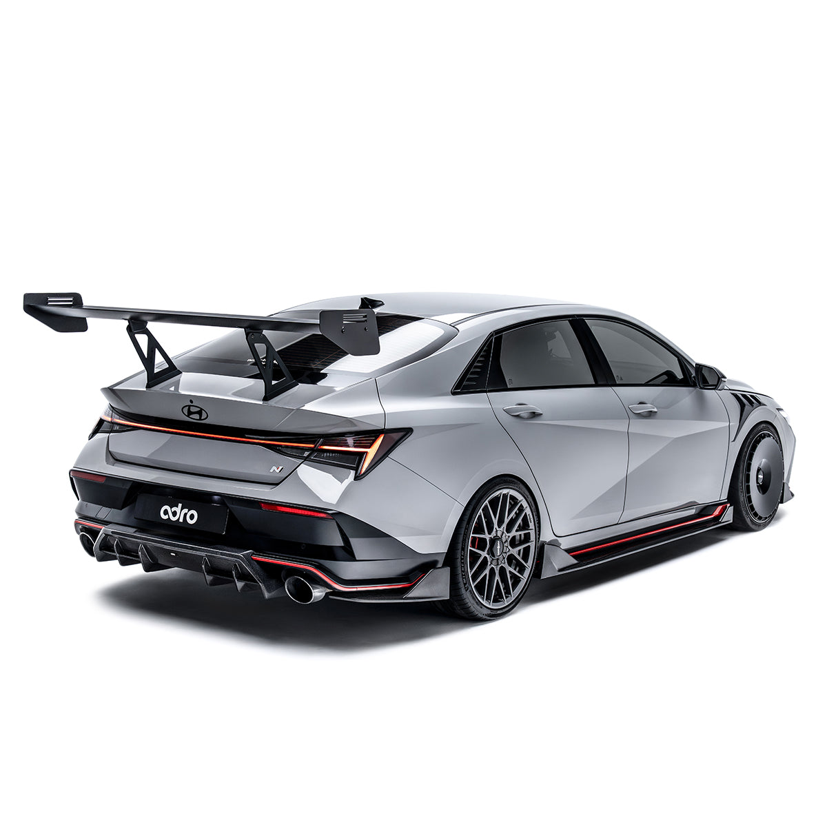 Rear diffuser, black finned aerodynamic trim with dual exhaust outlet openings