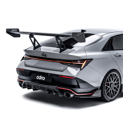 Rear diffuser side trim, black aerodynamic fins with dual exhaust outlet openings