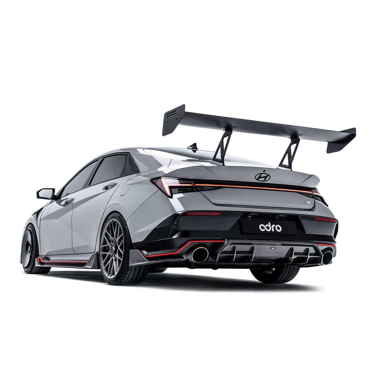 Rear diffuser and bumper insert, black finned design with twin exhaust outlet openings