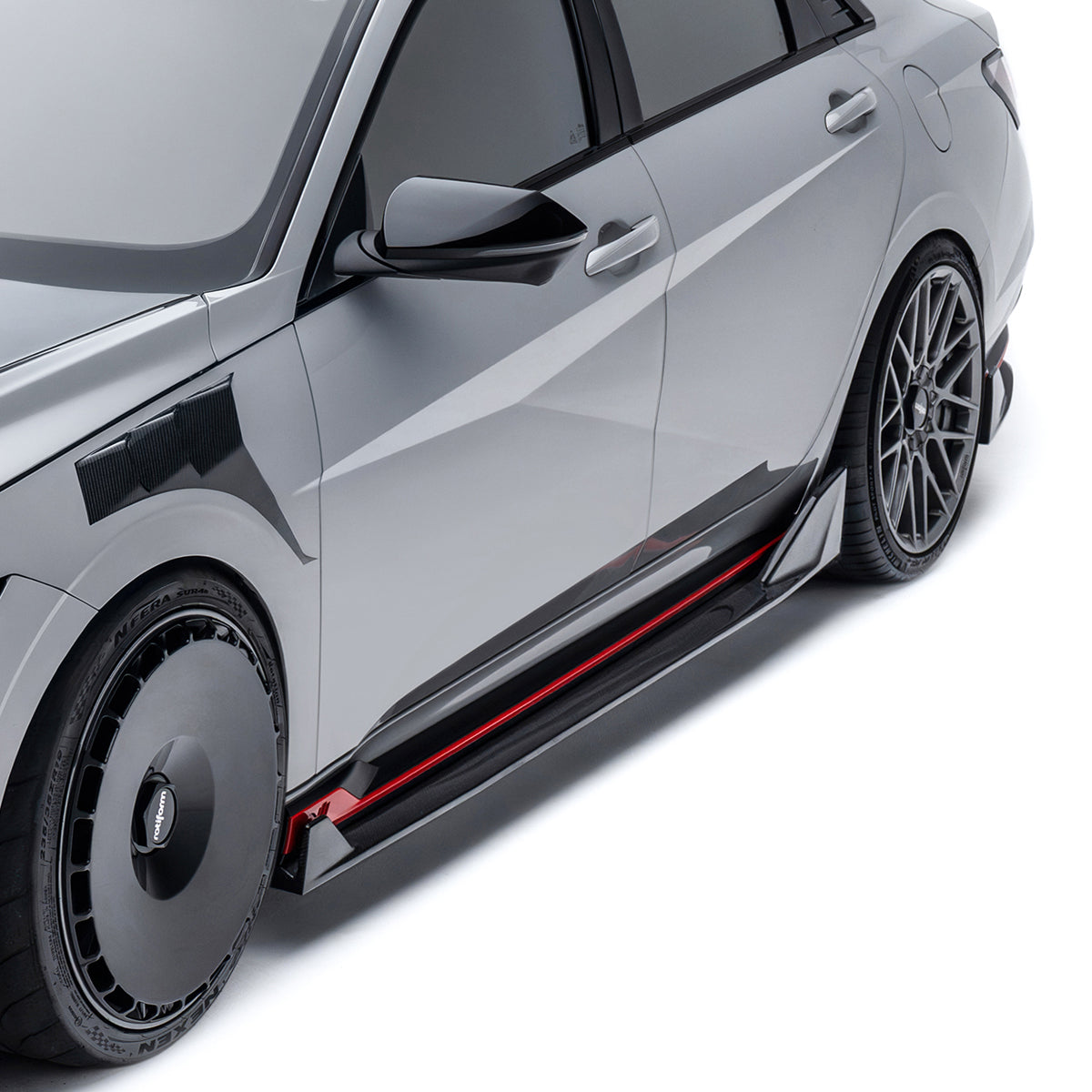 Black carbon fiber side skirt with red accent stripe and angular end pieces