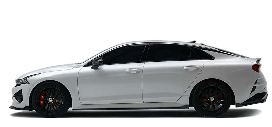 KIA K5 sport sedan in white with black grille and red-accent headlights