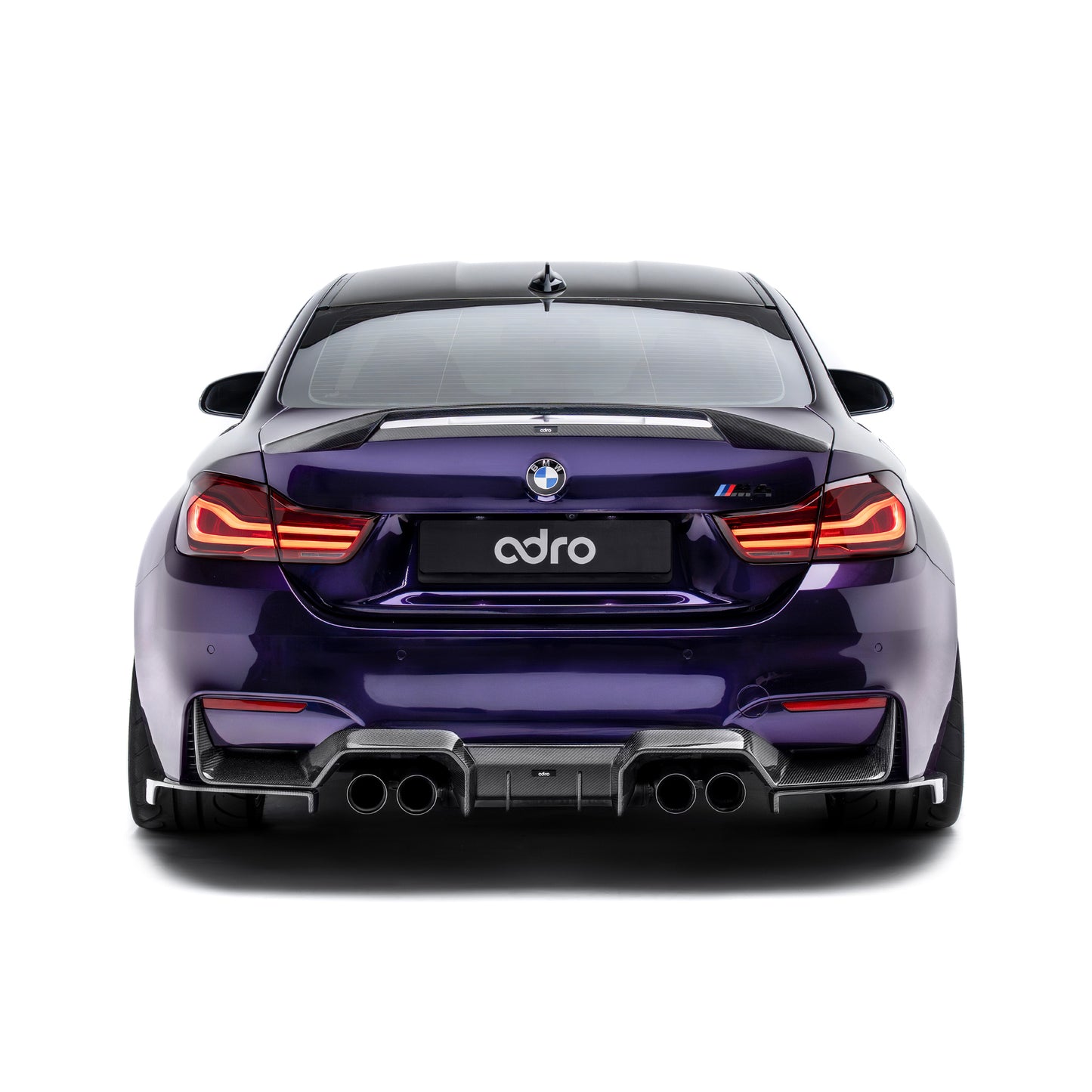 Carbon fiber rear diffuser panel with quad exhaust outlets, straight rear view
