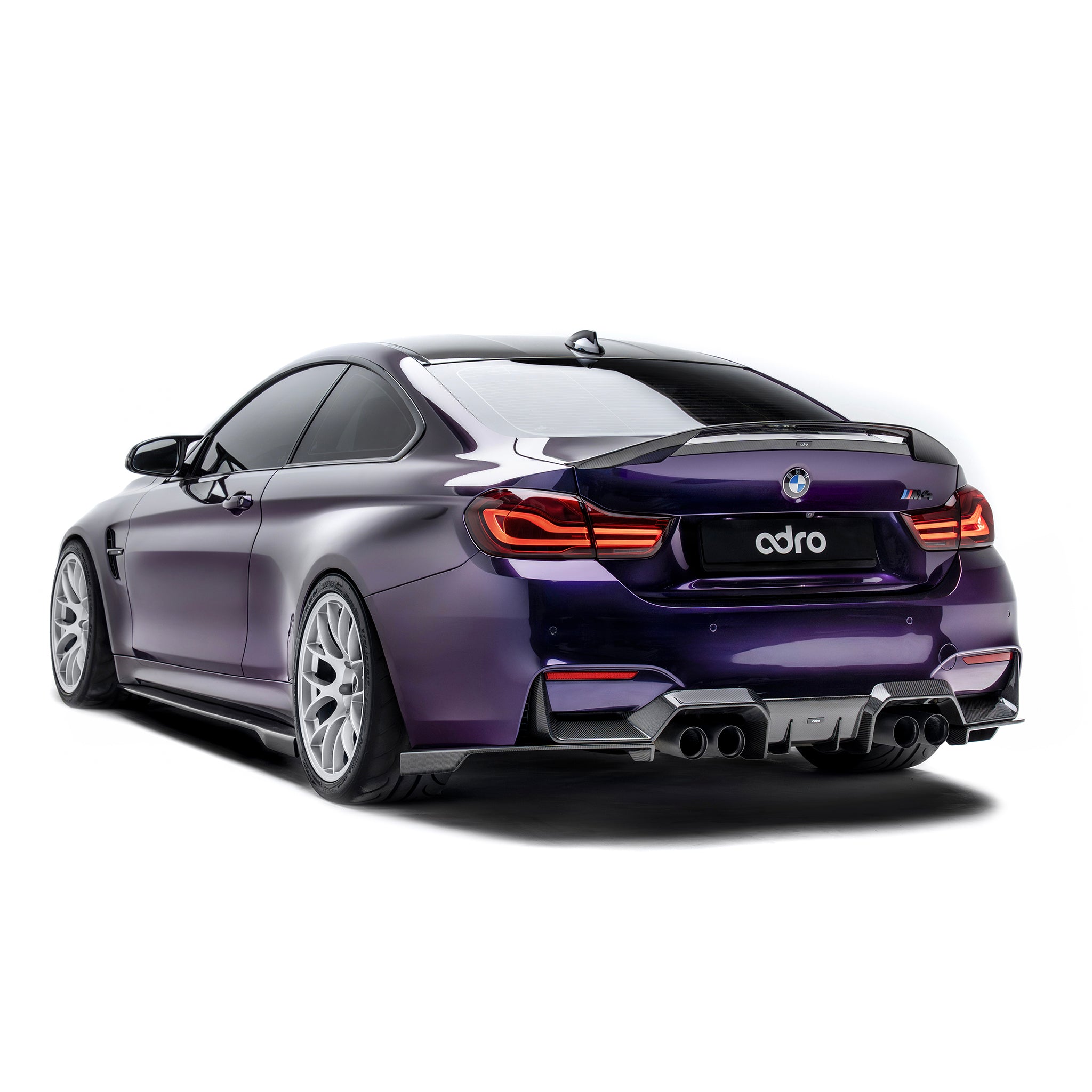 Carbon fiber rear diffuser with quad exhaust outlets, angled rear view