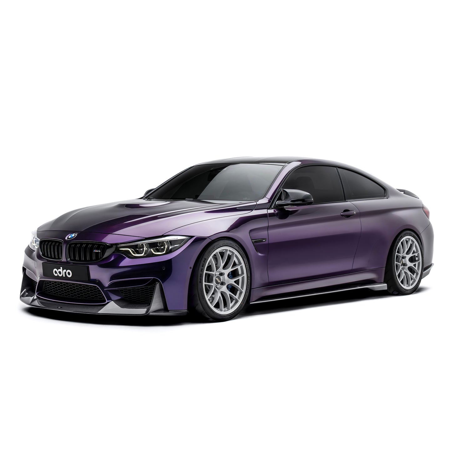 BMW front bumper lip spoiler in dark carbon fiber, side view with front lip