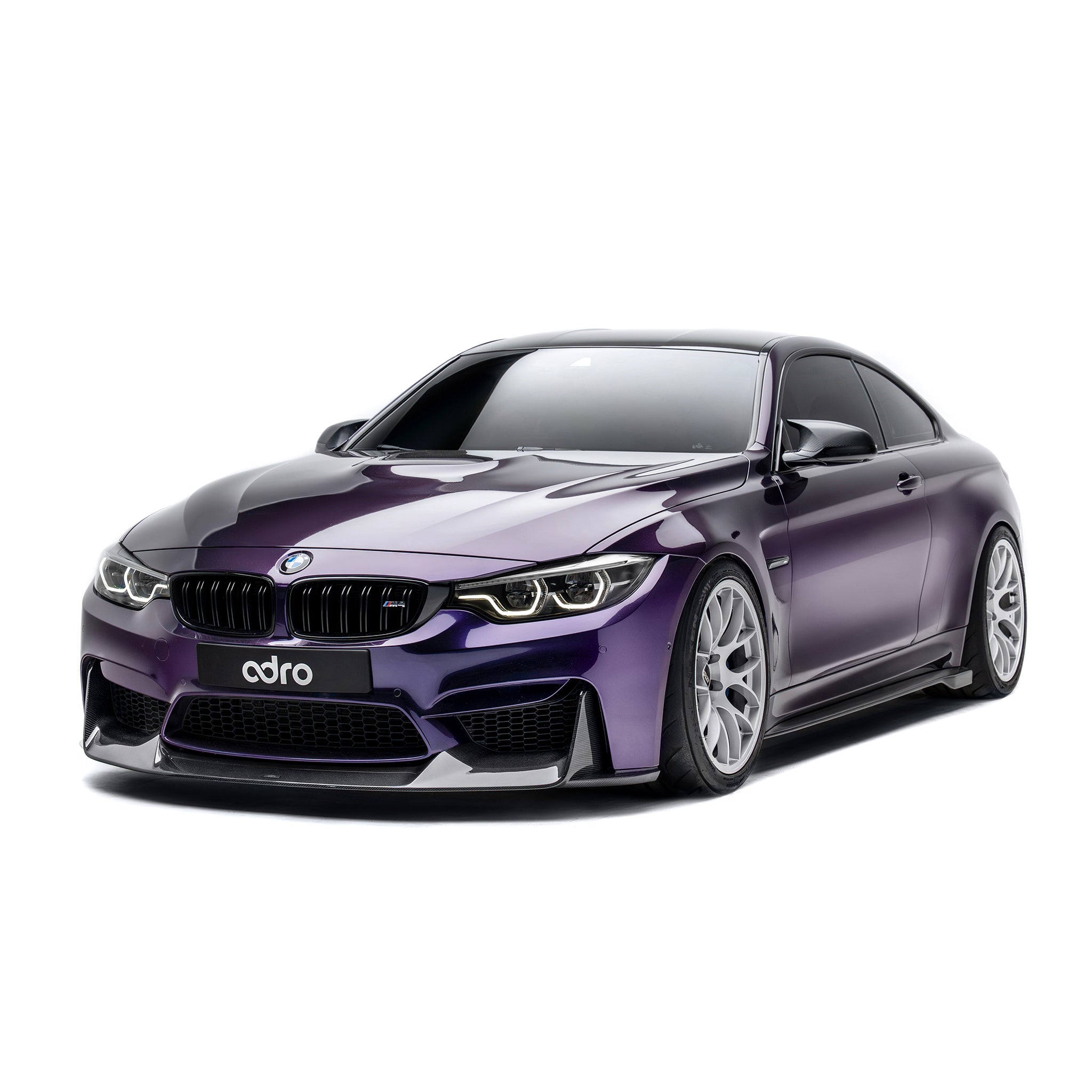 BMW front bumper lip spoiler in dark carbon fiber, front-right three-quarter view