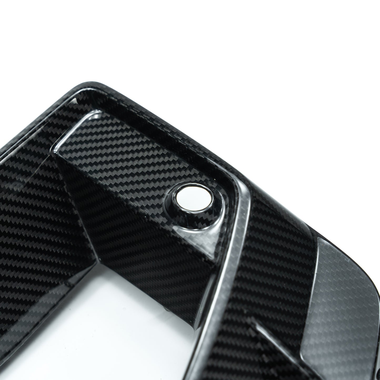 Carbon fiber duct vent bezel with round mounting hole and recessed channel