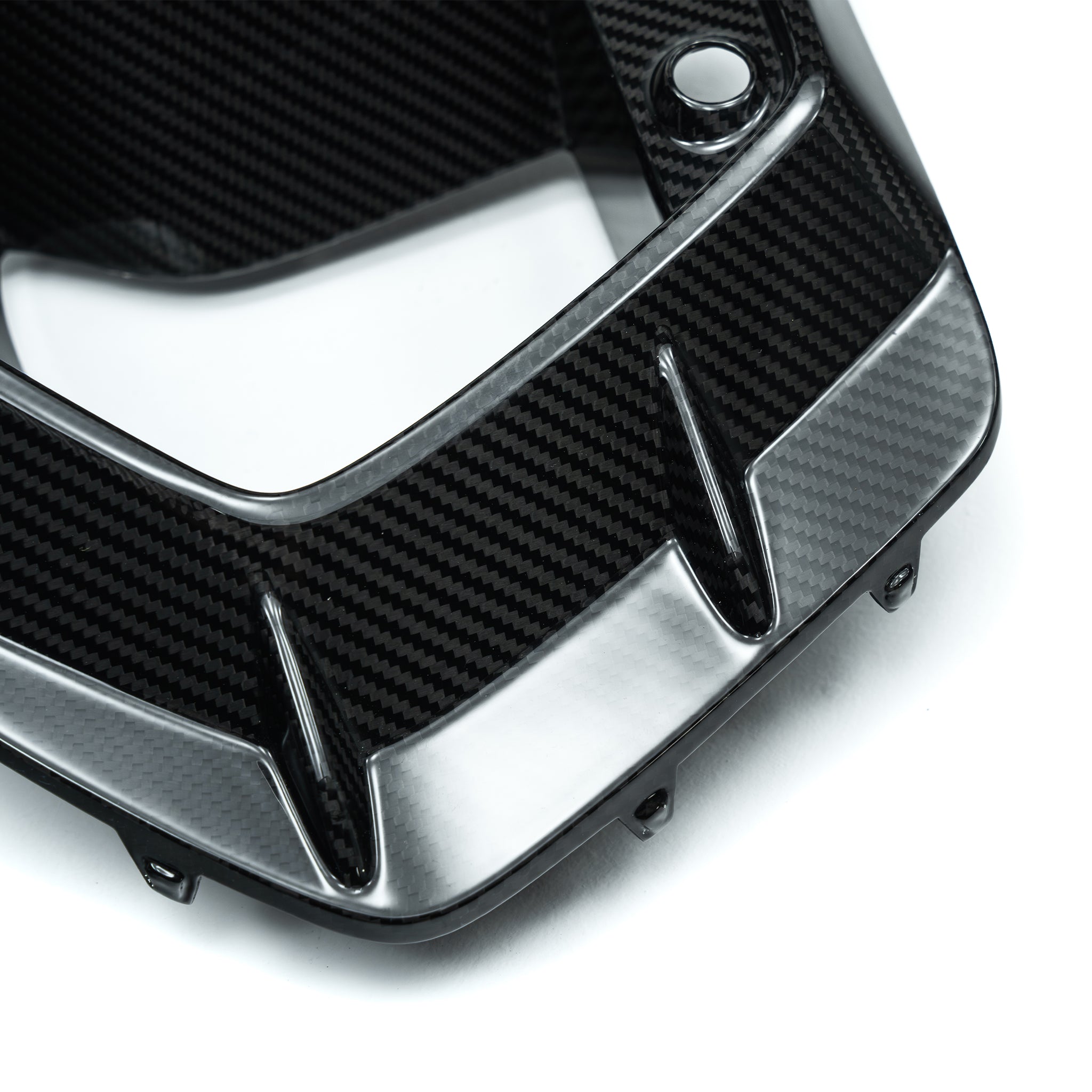 Carbon fiber duct vent surround with chrome-like edge trim and mounting holes
