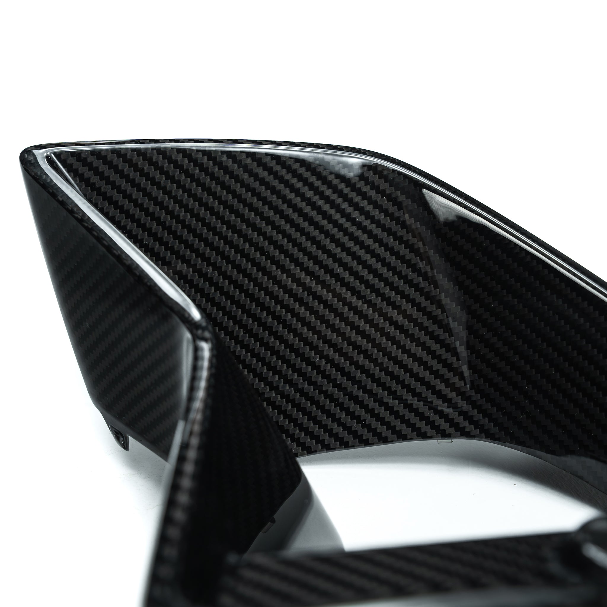 Carbon fiber duct vent side piece with glossy black weave and silver edge trim