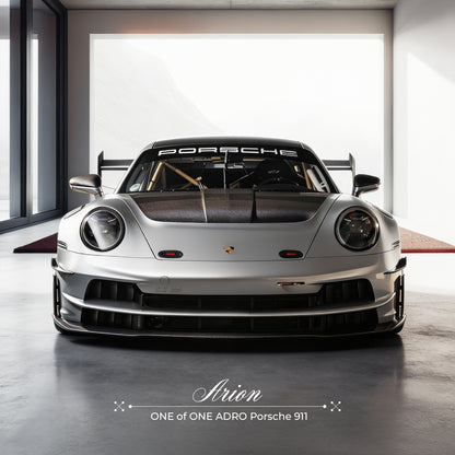 Silver Porsche 911 sports car with front grille and round headlights