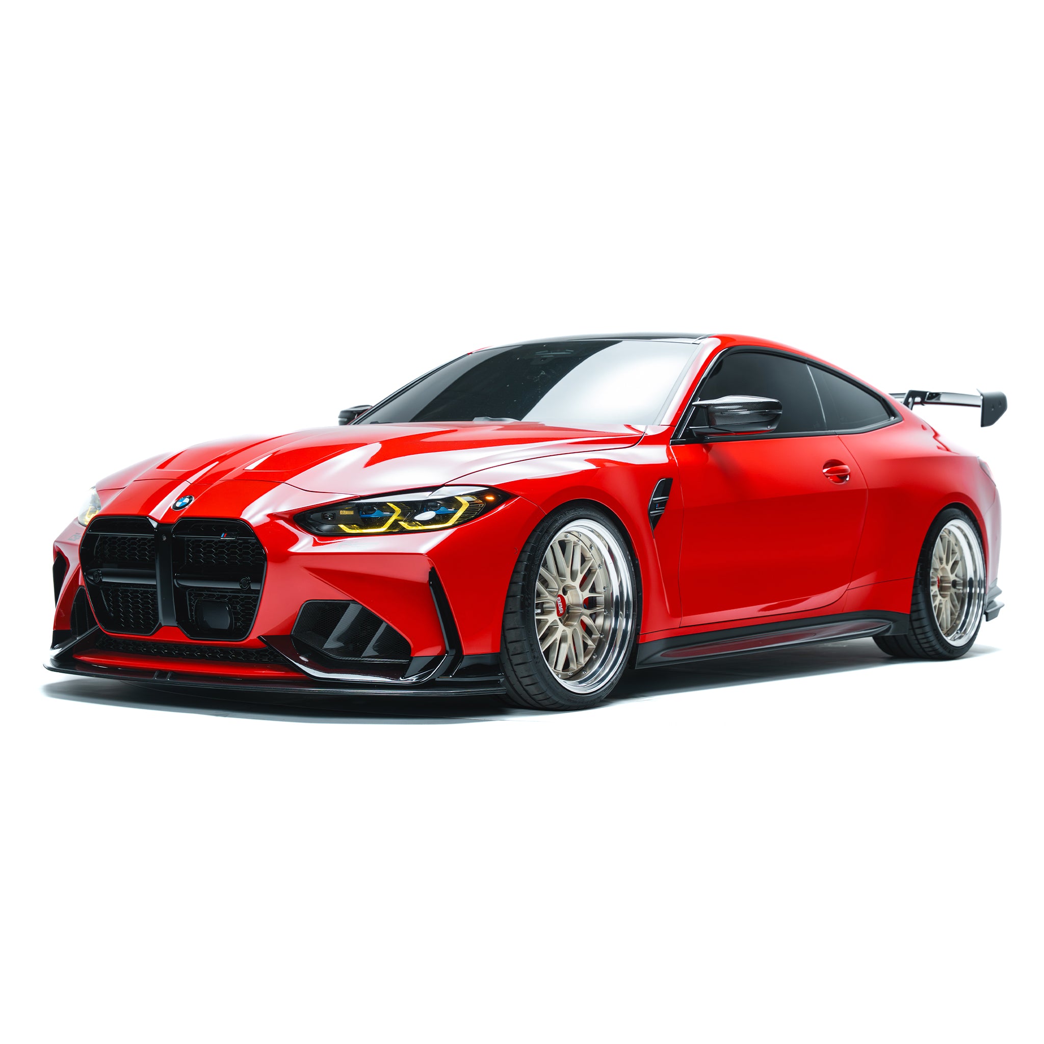 BMW M4 side skirts with black trim, front-to-back along rocker panel