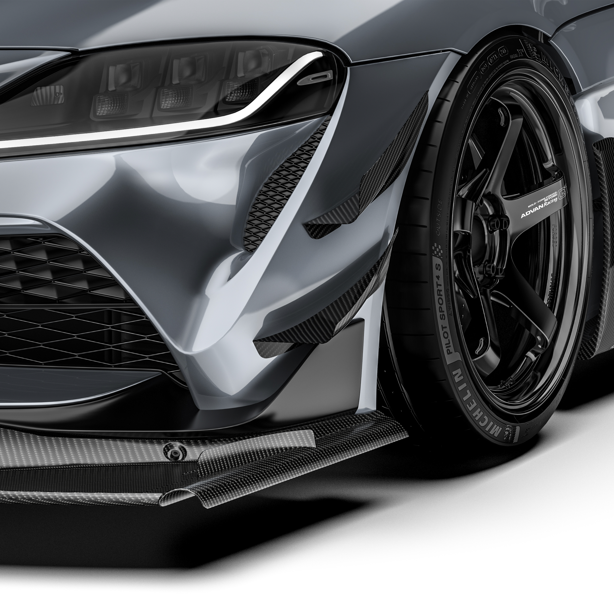 Front bumper carbon fiber canards with textured black finish and angled profile