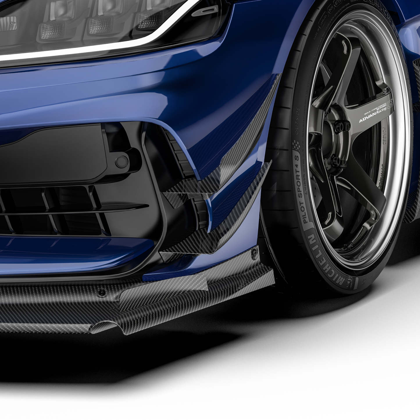 Front bumper canards with black carbon-fiber weave fins, close-up